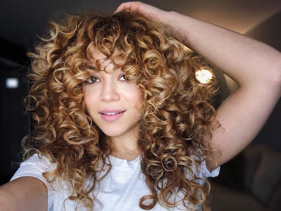 person with teased curls in hair