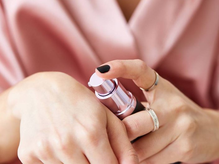 Person applying primer to their hand