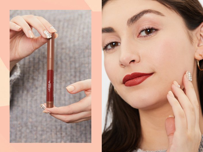 hands holding L’Oréal Paris Infallible Matte Lip Crayon, person wearing red lipstick