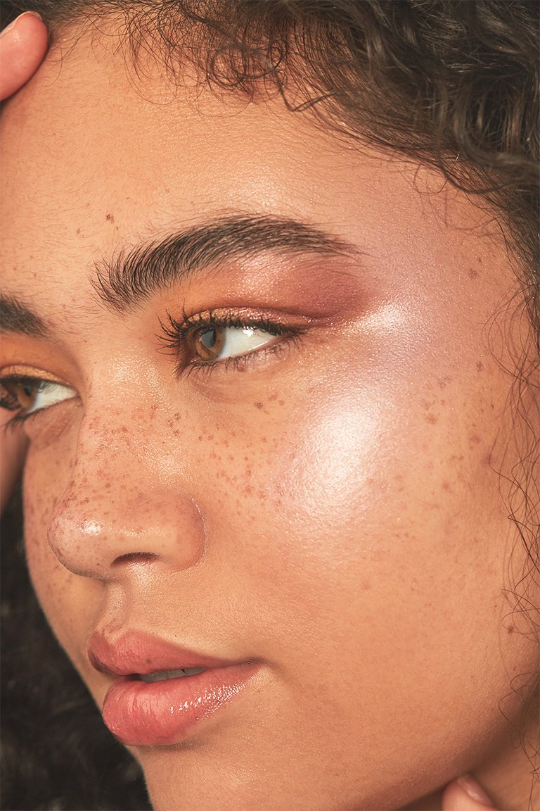 person wearing metallic makeup