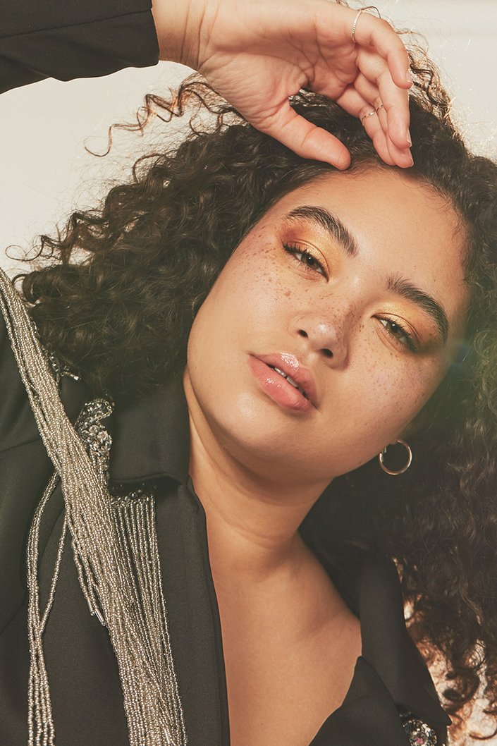 person wearing metallic makeup