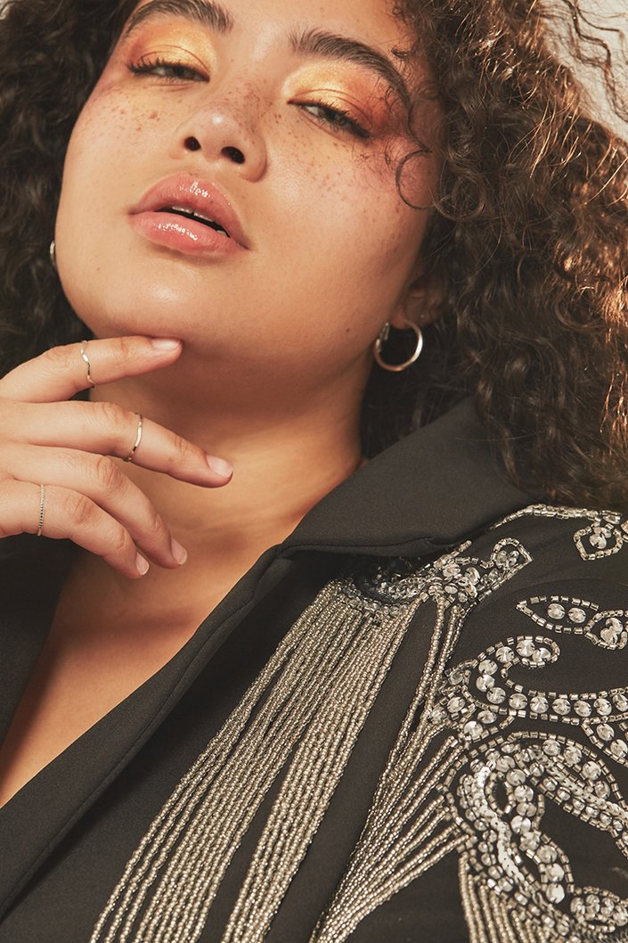 person wearing metallic makeup