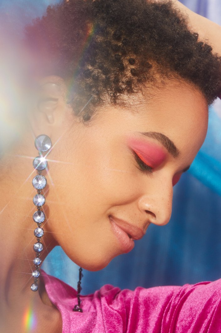 person wearing pink and coral eyeshadow