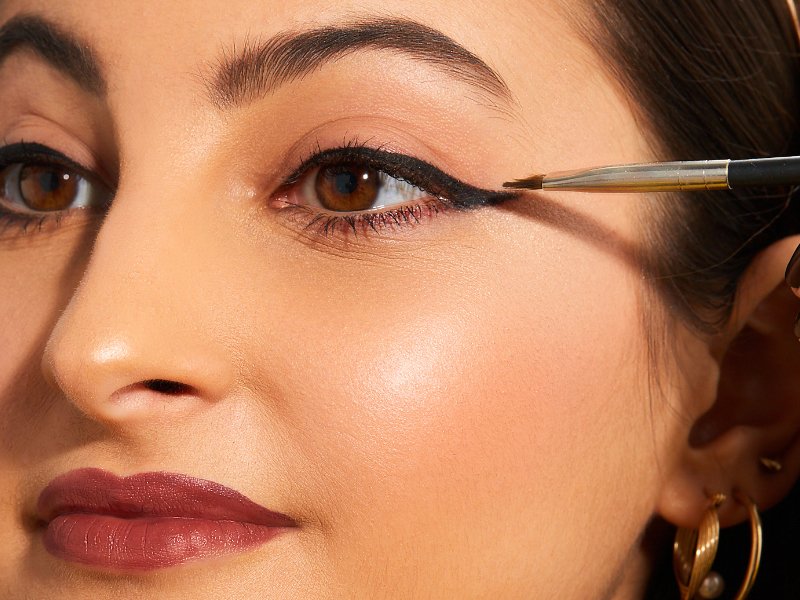 close-up of person wearing black winged eyeliner