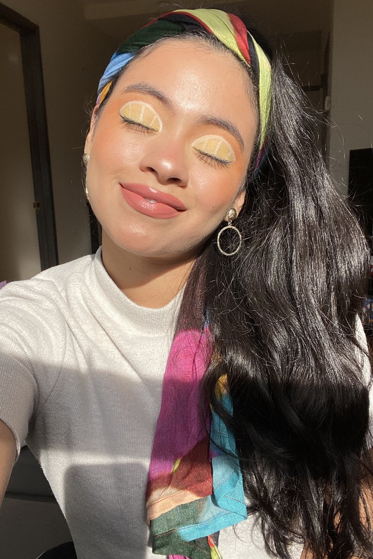 person wearing lemon eye makeup