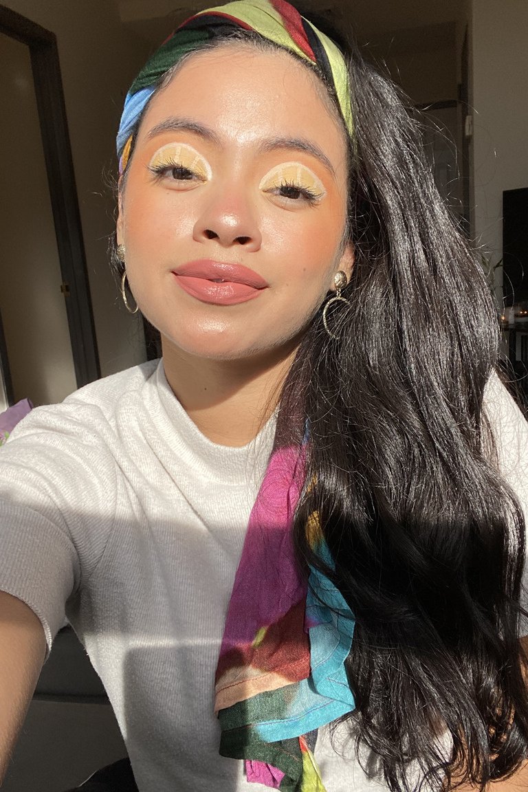 person wearing lemon eye makeup