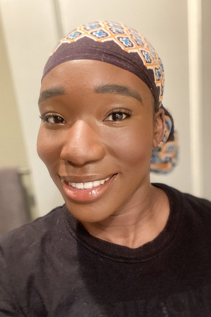 person wearing lip gloss