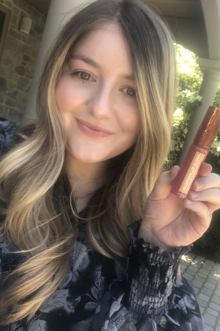 person wearing lip gloss