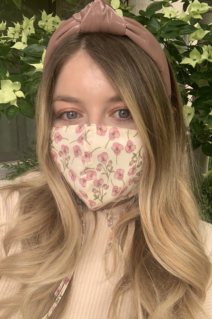 person wearing floral face mask