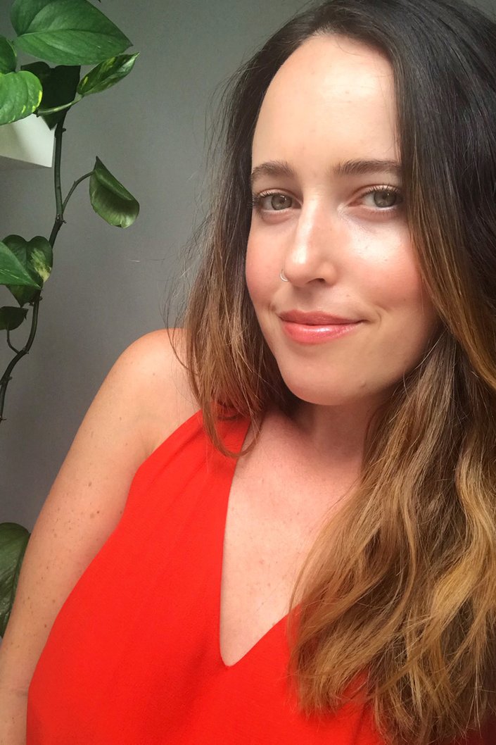 person wearing orange shimmery lipstick