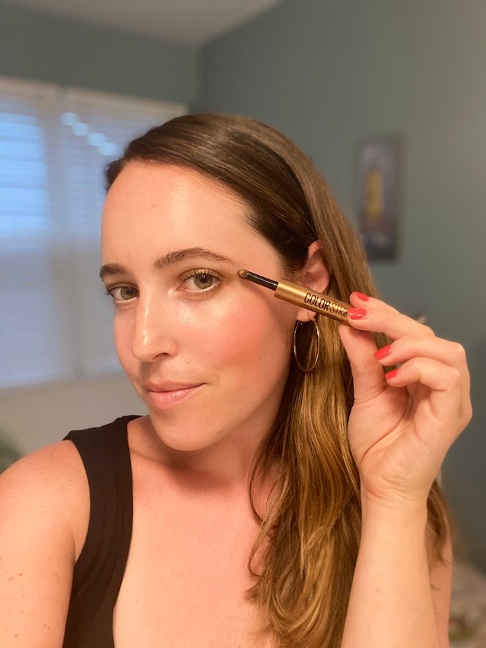 person wearing Maybelline New York Color Strike Cream-to-Powder Eyeshadow Pen in Rally