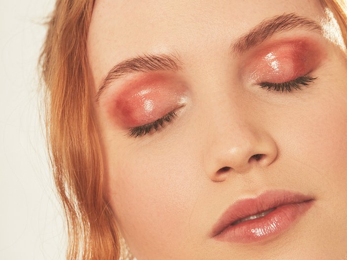 person wearing pink eye gloss and lip gloss