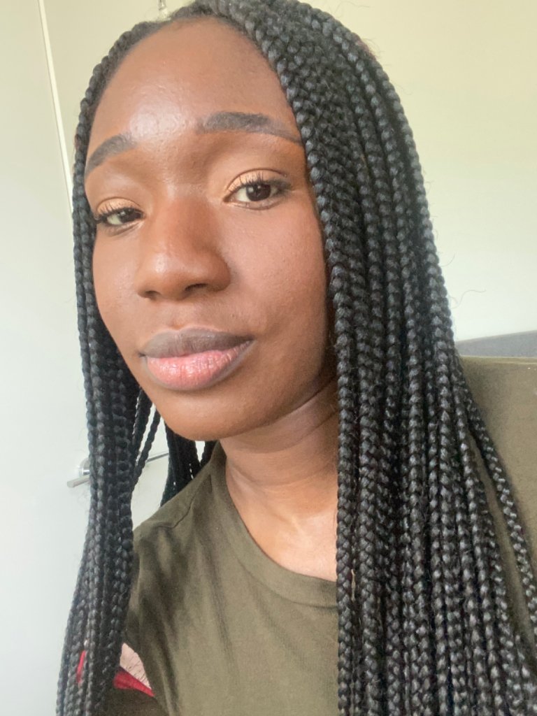 person wearing IT Cosmetics Your Skin But Better Foundation + Skincare in Deep Cool 59