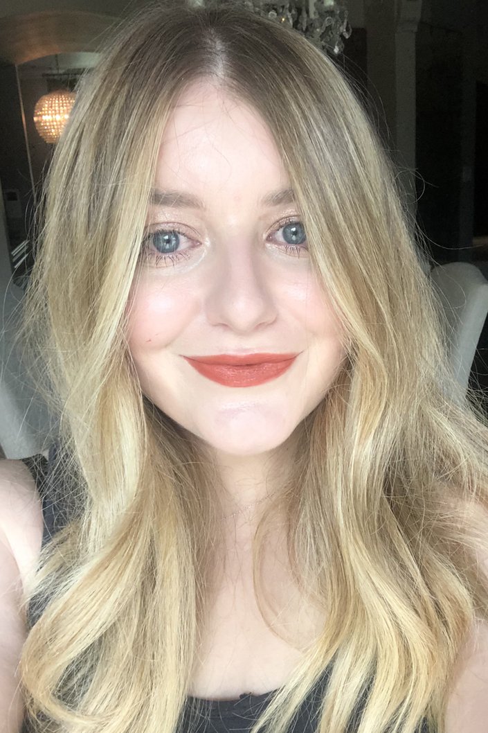 person wearing Lancôme L’Absolu Rouge Intimatte Lipstick in Love Rendez-Vous