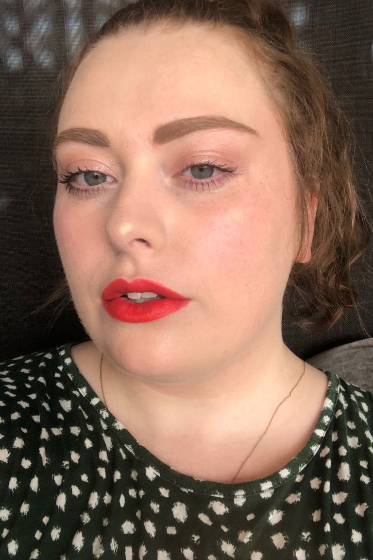 person wearing Lancôme L’Absolu Rouge Intimatte Lipstick in Not Flirting