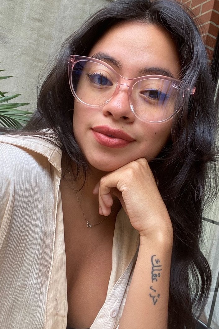 person wearing Lancôme L’Absolu Rouge Intimatte Lipstick in Timeless Appeal