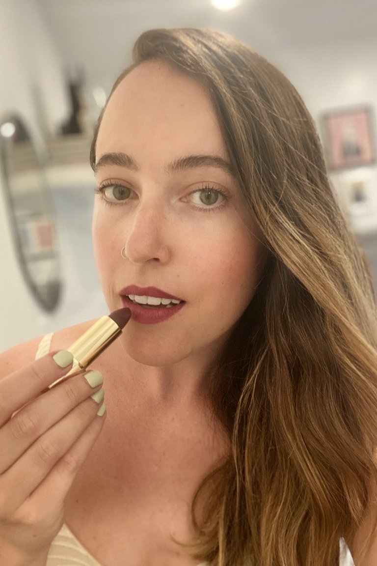 person wearing Lancôme L’Absolu Rouge Intimatte Lipstick in Beloved Berry