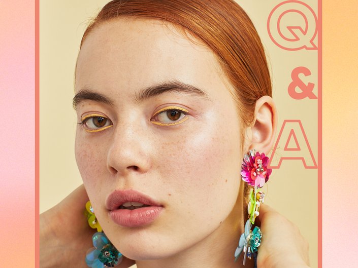 person with red hair wearing yellow eyeliner