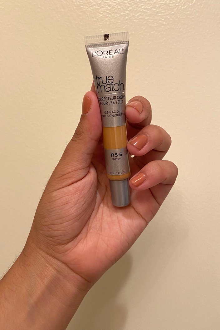 hand holding L’Oréal Paris True Match Eye Cream Concealer