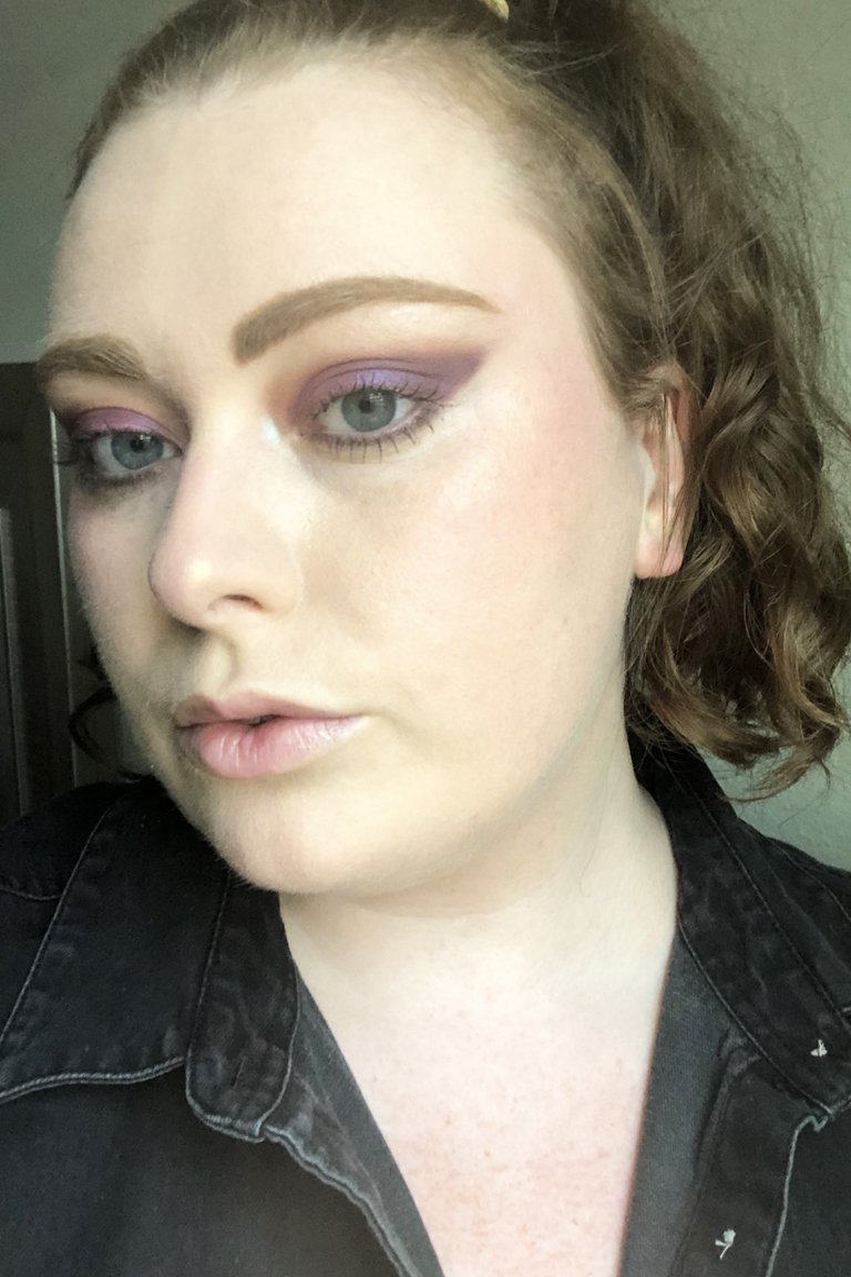 person wearing violet smoky eye makeup