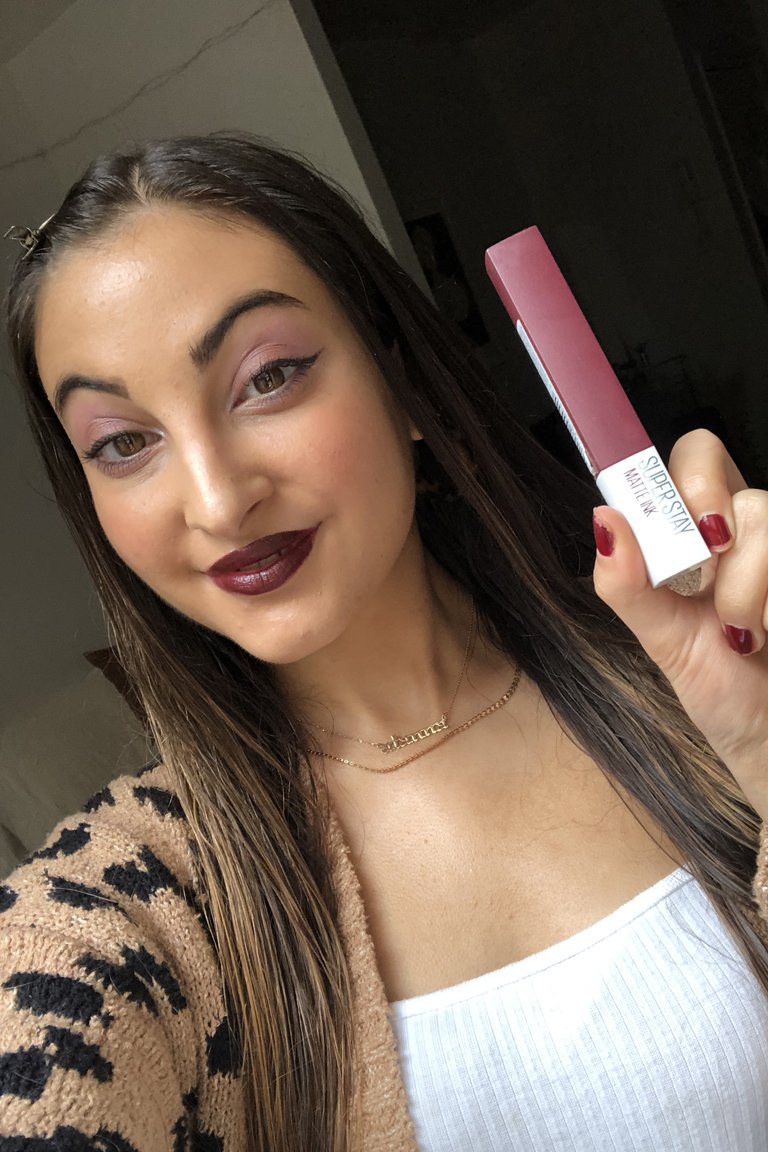 person with medium skin tone wearing berry lipstick