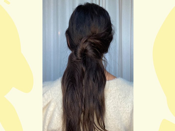 person wearing a knotted ponytail