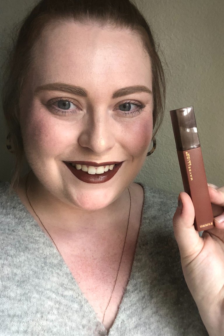 person wearing Maybelline New York Super Stay Matte Ink Liquid Lipstick in Cocoa Connoisseur
