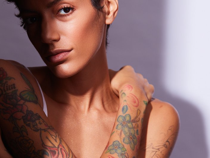 person with arms covered in tattoos