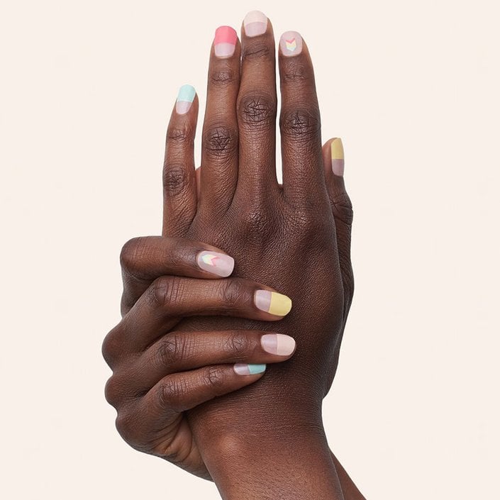 hands with manime nail stickers on nails