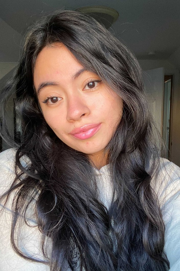 person wearing IT Cosmetics Pillow Lips Solid Serum Lip Gloss in Wink