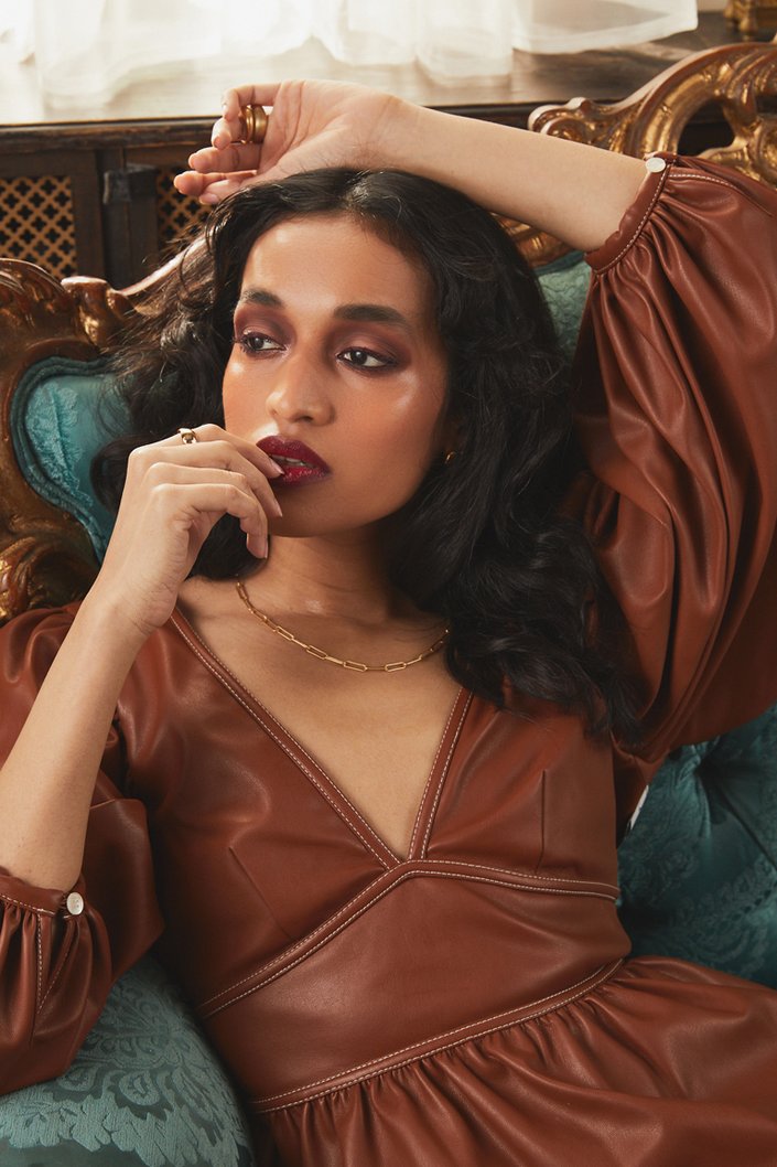 person wearing burgundy makeup