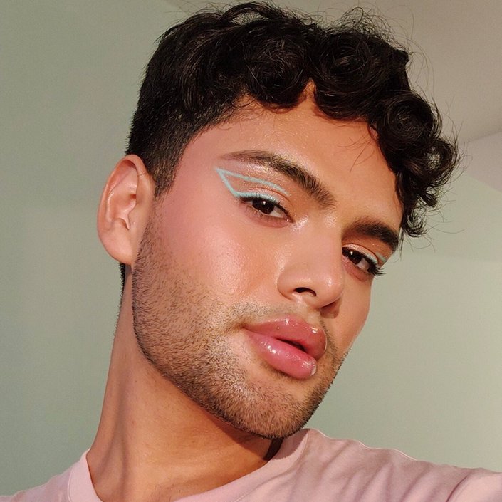 person wearing pastel graphic eye makeup