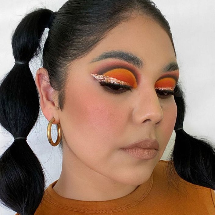 person wearing glitter eye makeup