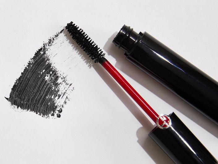 Picture of a mascara tube and mascara swatched on a white background