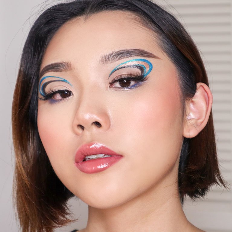 person wearing graphic eye makeup