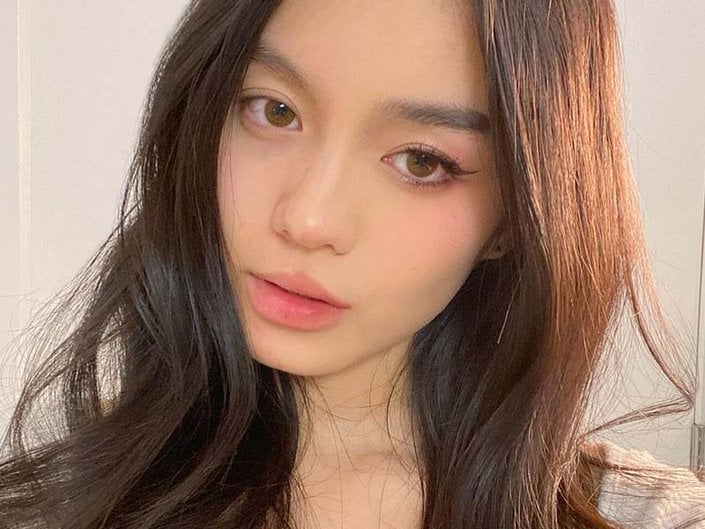 Picture of a person with monolids wearing winged eyeliner