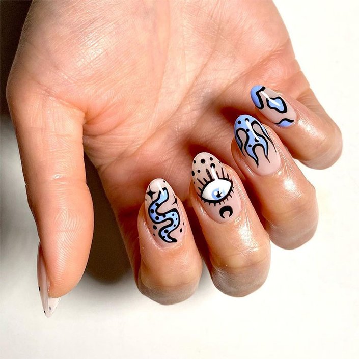 hand with very peri colored nail art on nails