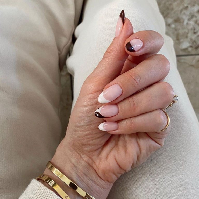 hand with ying yang french manicure