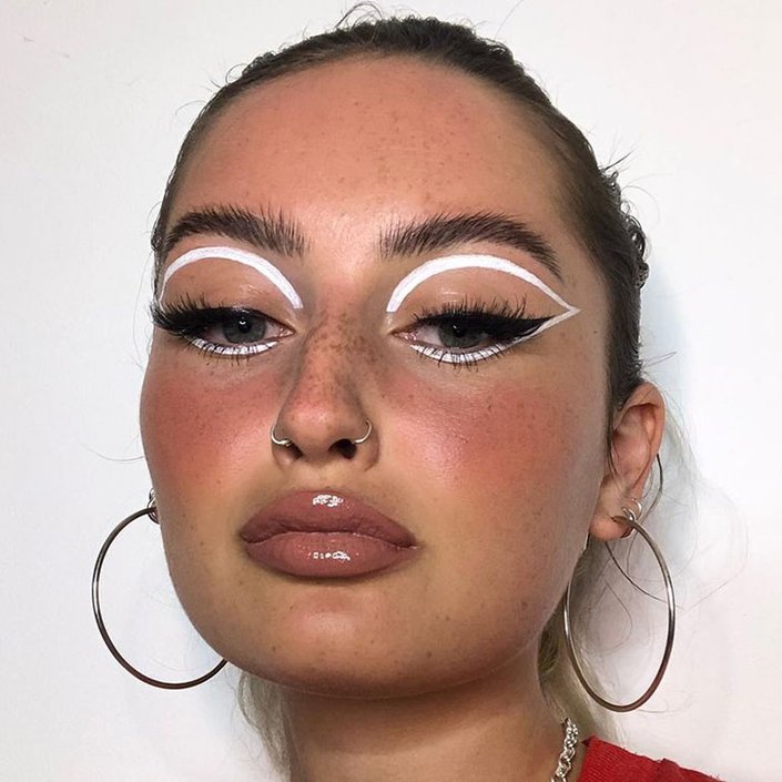 person wearing white eye makeup