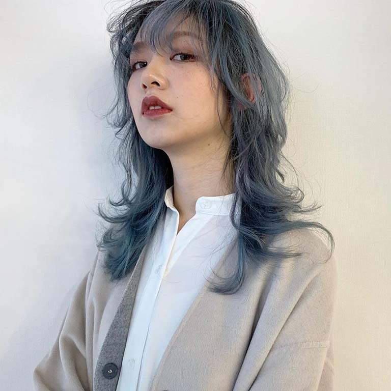 person with dark blue gray hair
