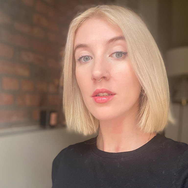 person with blonde hair cut into bob