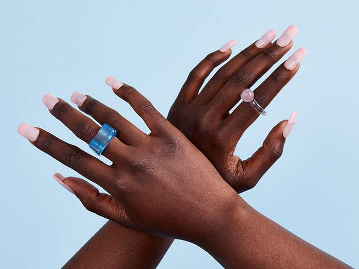 hands with nails painted light pink