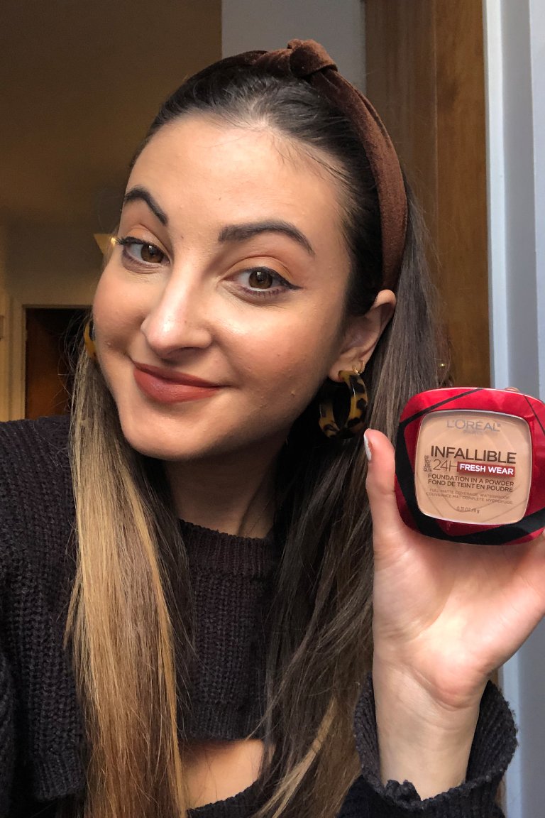 person wearing l'oreal paris infallible foundation in a powder in sand