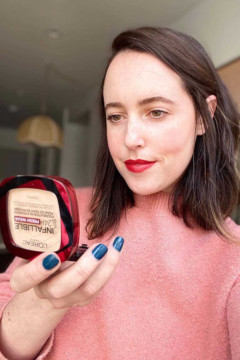person wearing l'oreal paris infallible foundation in a powder in porcelain