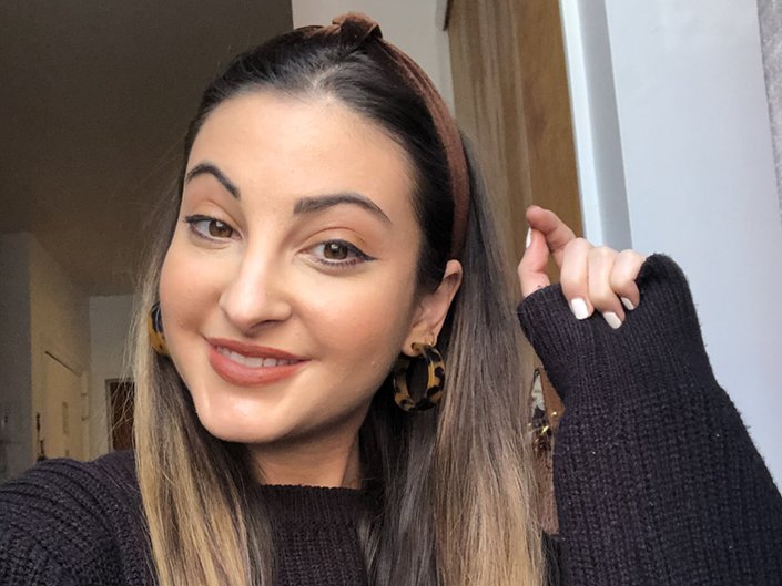 person wearing rust matte lipstick