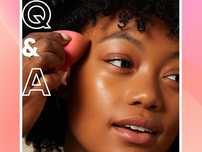 person holding makeup sponge to face