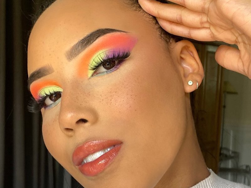 person wearing colorful eyeshadow