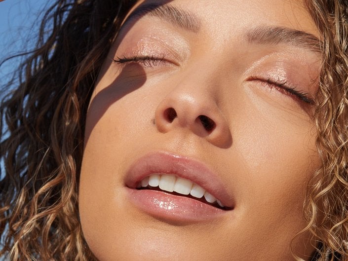 person wearing balm on eyes and lips