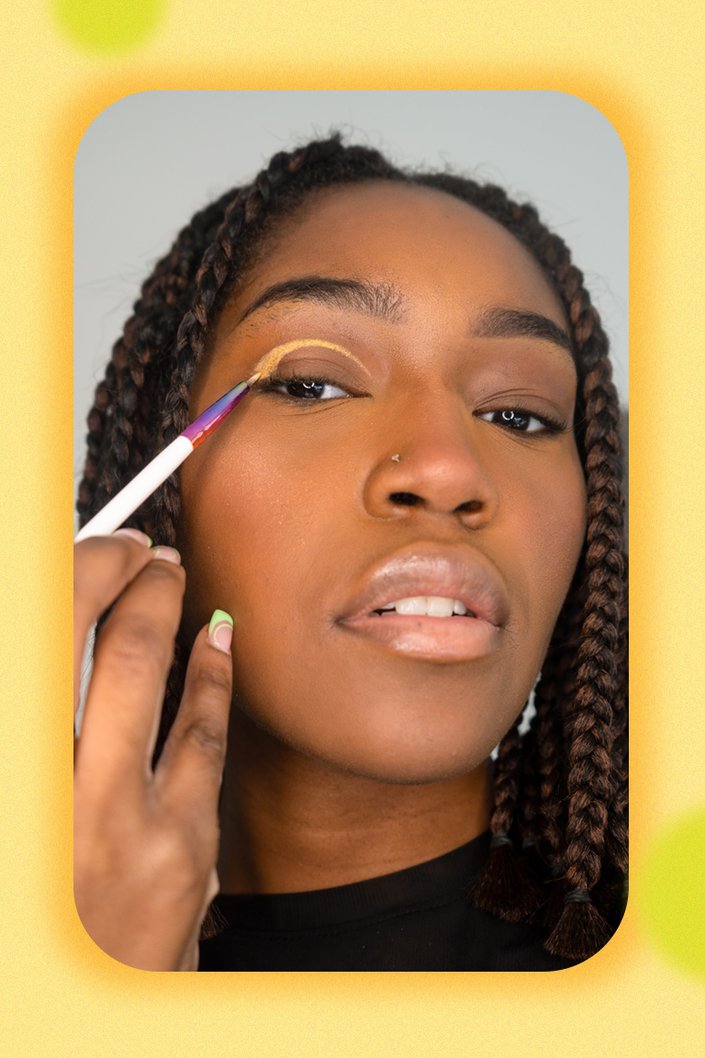 person applying eye makeup