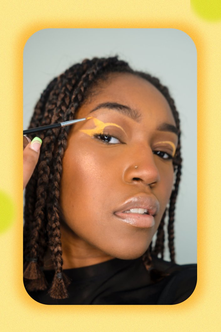 person applying eye makeup